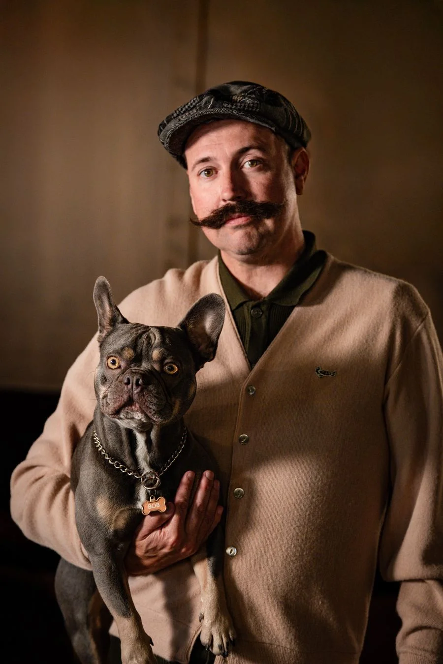 Judah Leary holding the shop dog